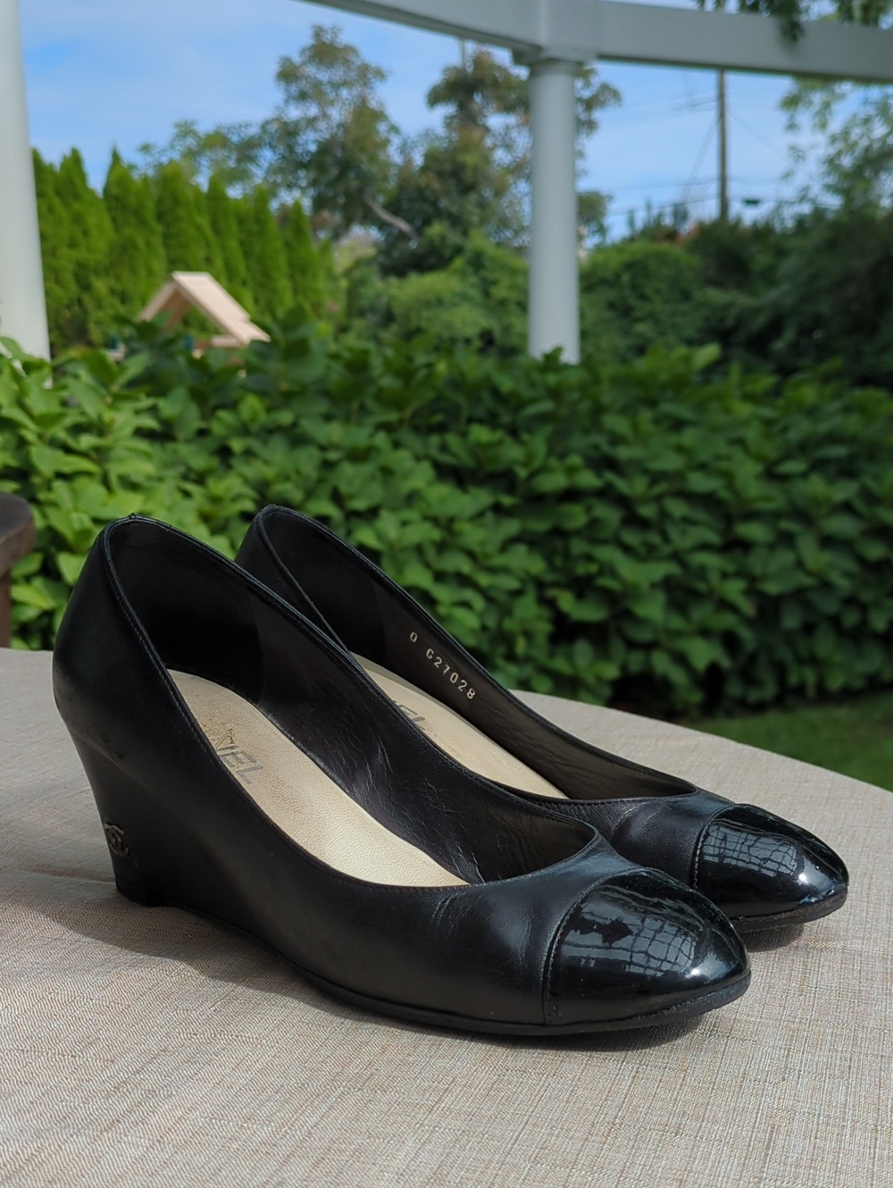 CHANEL Black Leather Wedge Pumps with Patent Cap Toe